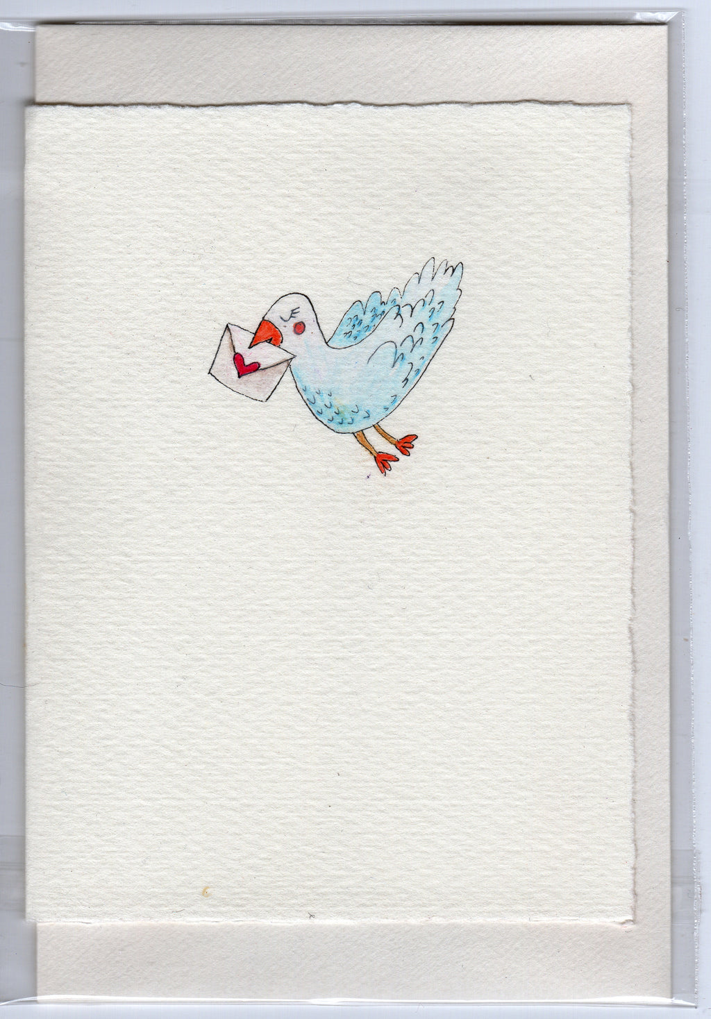 Dove holding love note